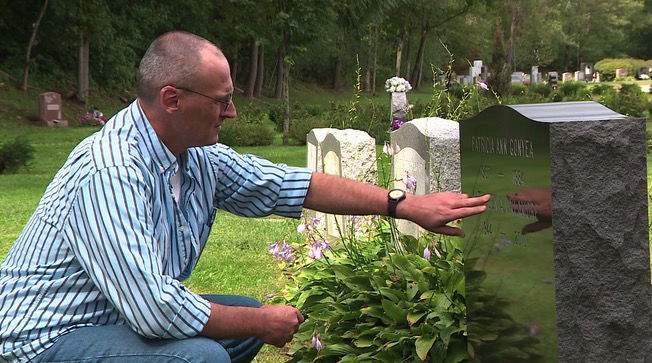 <i>WCVB via CNN Newsource</i><br/>Frank Gonyea visits the grave of his sister Patricia.