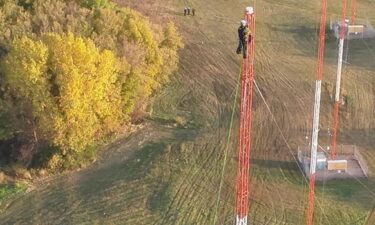 Video captured rescuers climbing 250 feet up a radio tower to make a sky-high save in the south metro.