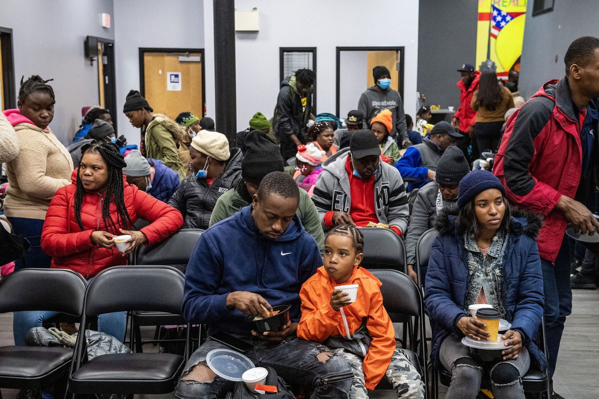 <i>Joseph Prezioso/AFP/Getty Images via CNN Newsource</i><br/>Migrants eat a meal at the La Colaborativa day shelter in Chelsea