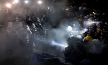 Police officers clash with pro-Palestinian protesters as a fire extinguisher is deployed at UCLA in Los Angeles