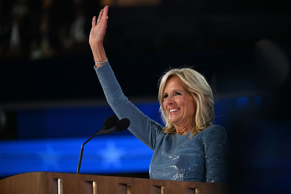 <i>Rebecca Wright/CNN via CNN Newsource</i><br/>First lady Jill Biden waves from the stage on the opening night of the DNC on Monday