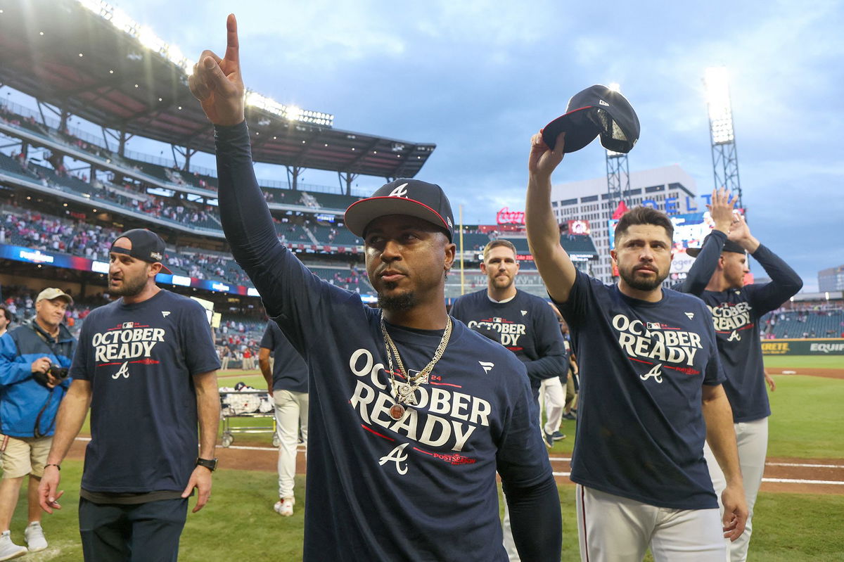 <i>Jason Allen/AP via CNN Newsource</i><br/>The New York Mets celebrate in the locker room after clinching a playoff berth with their come-from-behind victory against the Atlanta Braves.