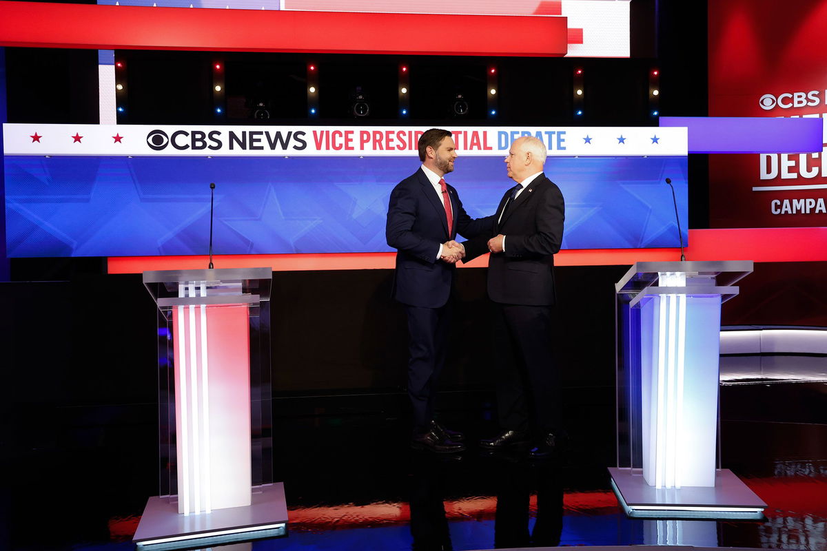 <i>Anna Moneymaker/Getty Images via CNN Newsource</i><br/>Ohio Sen. JD Vance and Minnesota Gov. Tim Walz greet each other ahead of a debate at the CBS Broadcast Center on October 1 in New York City.