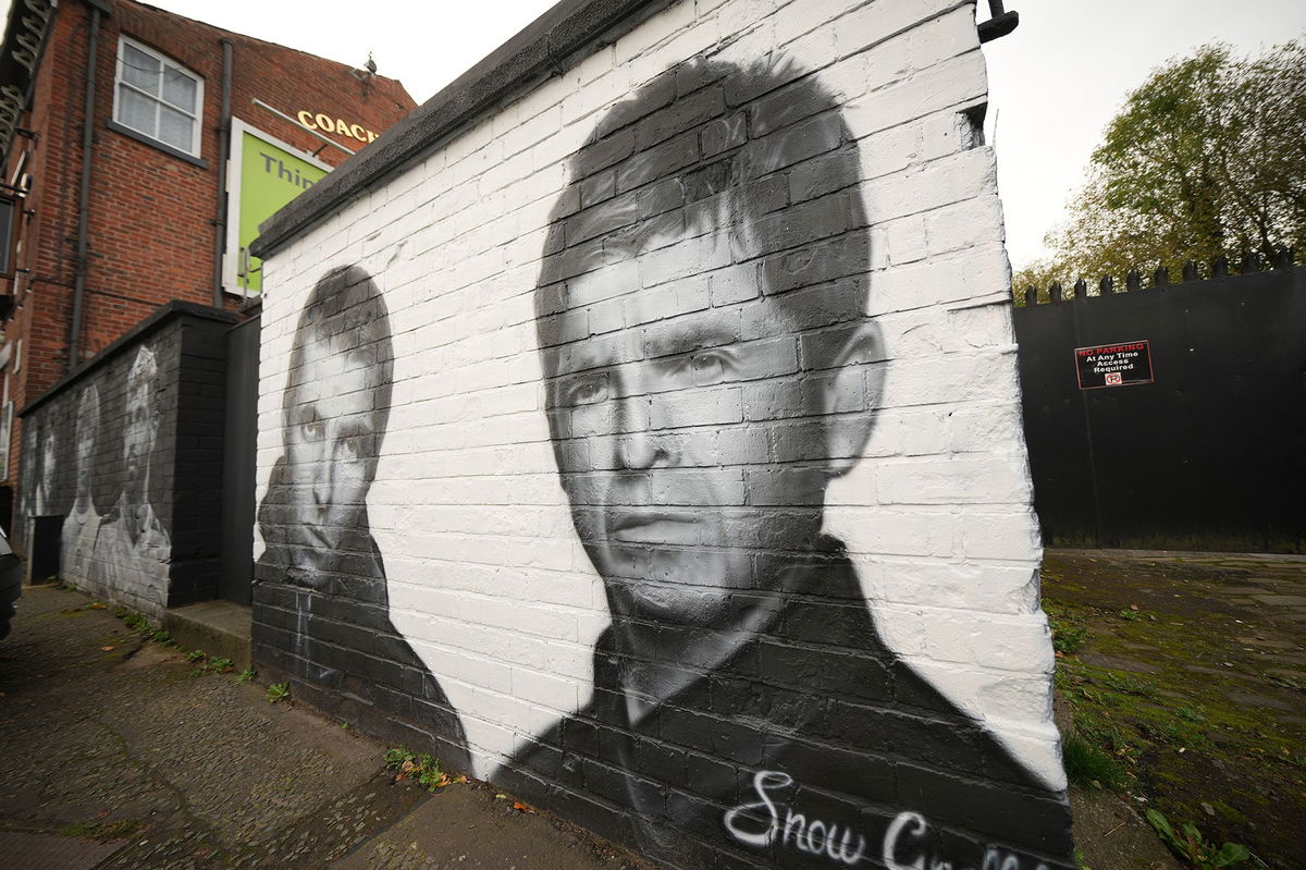 <i>Christopher Furlong/Getty Images via CNN Newsource</i><br/>A mural depicting Liam and Noel Gallagher by artist Snow Graffiti adorns a wall at the Coach and Horses pub in Whitefield on October 21