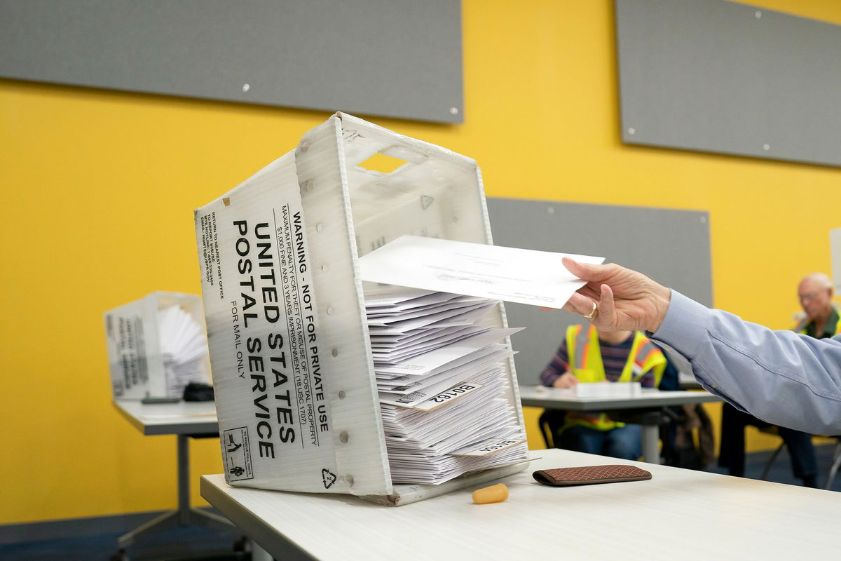 <i>Allison Joyce/Getty Images via CNN Newsource</i><br/>Absentee ballots are prepared to be mailed at the Wake County Board of Elections on September 17 in Raleigh