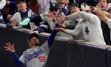 Two New York Yankees fans were ejected from Game 4 of the World Series after ripping the ball from Los Angeles Dodgers star Mookie Betts’ glove.