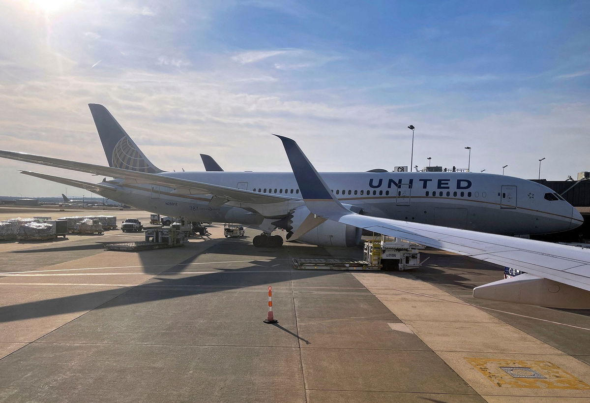 <i>Daniel Slim/AFP/Getty Images/File via CNN Newsource</i><br/>A United Airlines Boeing 787-8 Dreamliner is parked at a gate at Dulles Washington International Airport in this March 2021 file photo.