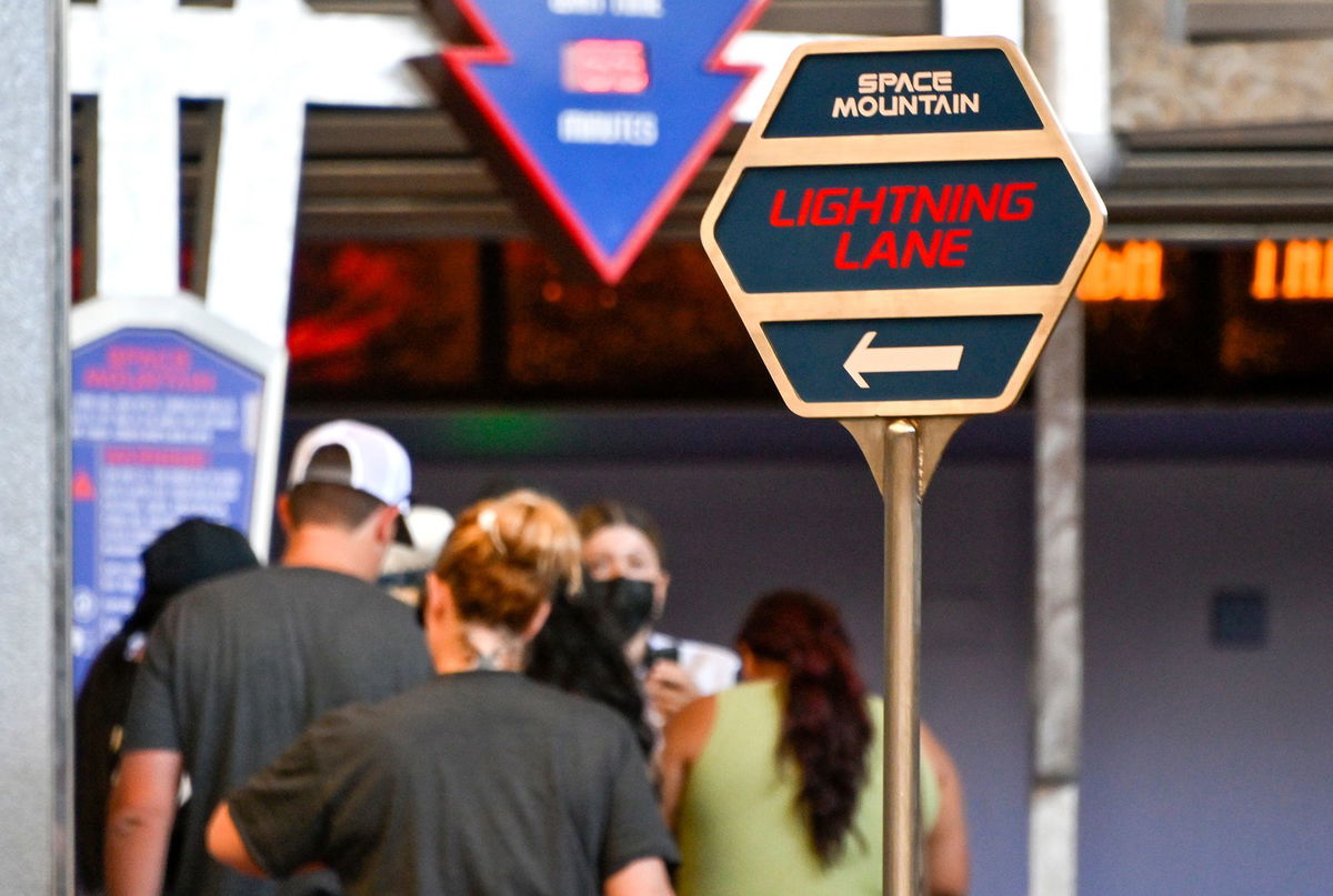 <i>Jeff Gritchen/MediaNews Group/Orange County Register/Getty Images via CNN Newsource</i><br/>Folks line up in the Lightning Lane at Space Mountain at Disneyland in California in August 2022.