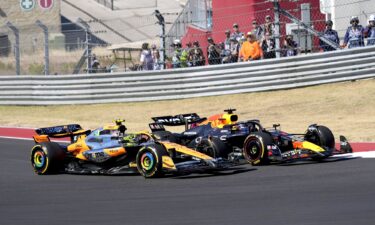 Norris (left) and Verstappen race through a turn during the US Grand Prix.