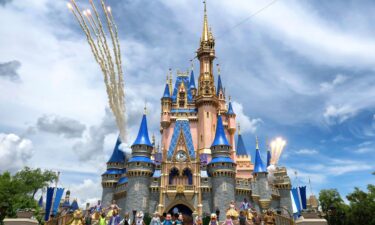 Daytime fireworks launch over Cinderella Castle in the Magic Kingdom at Walt Disney World on April 30