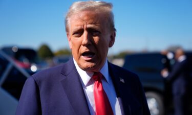 Republican presidential nominee former President Donald Trump speaks with reporters upon arrival at Philadelphia International Airport