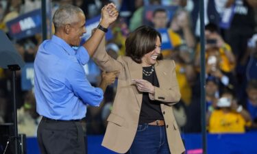 Former President Barack Obama gestures after introducing Vice President Kamala Harris at a campaign rally in Clarkston