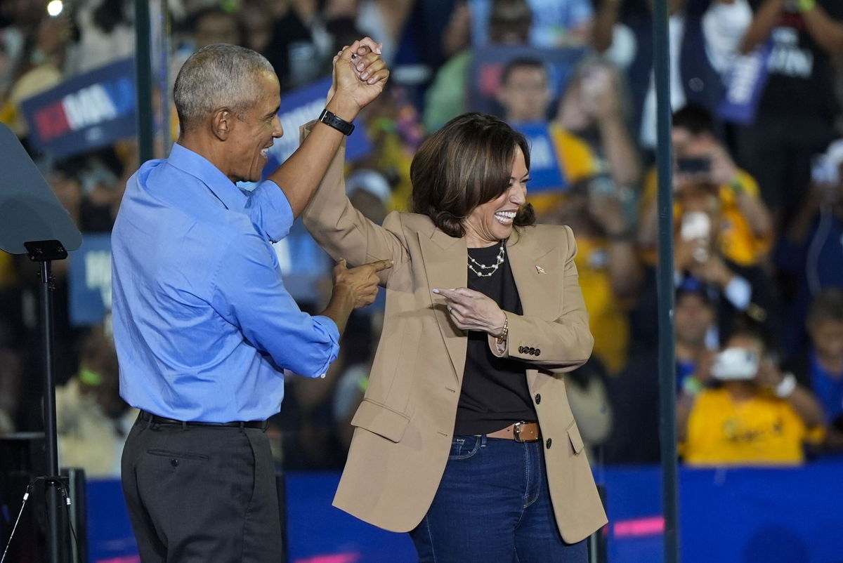 <i>Mike Stewart/AP via CNN Newsource</i><br/>Former President Barack Obama gestures after introducing Vice President Kamala Harris at a campaign rally in Clarkston