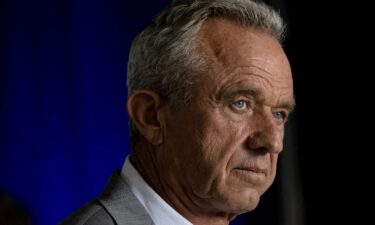 Robert F. Kennedy Jr. takes questions from reporters during a campaign event in Aurora