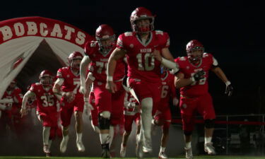 The Madison Bobcats emerge from the tunnel ahead of a game.