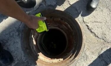 Firefighters rescued a woman after she fell more than a dozen feet into a manhole at the previous site of the Carousel Mall in San Bernardino on Wednesday.