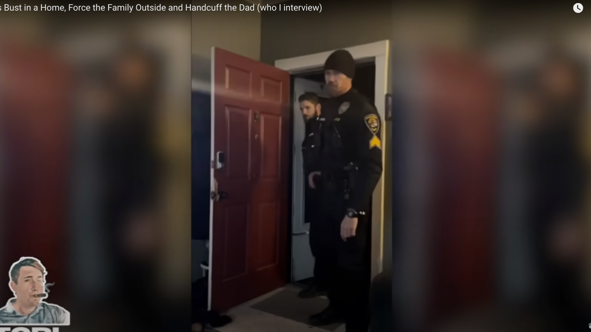 A screen shot of video taken by Kyle Adam of Idaho Falls Police entering his home.