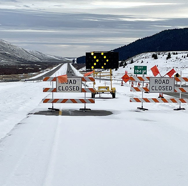 Road closed signs at Exit 184 on I-15.