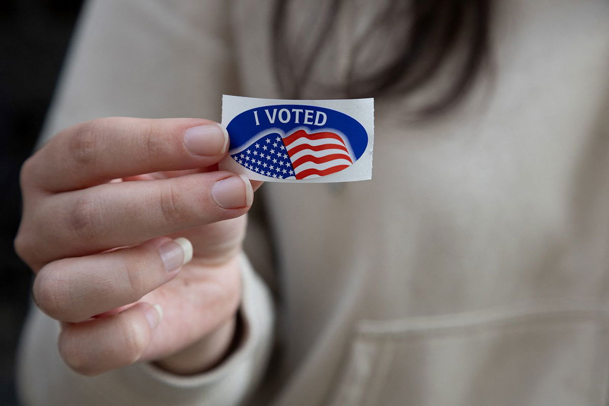 <i>Rebecca Droke/AFP/Getty Images via CNN Newsource</i><br/>A woman shows off her 