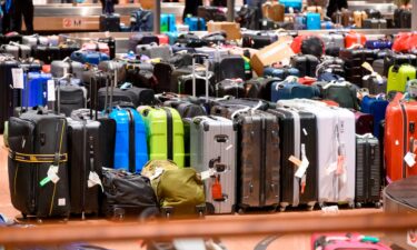 Suitcases roll onto a plane at Dresden International Airport in Germany. Your bags have a better chance of arriving at your destination on time if you come to the departing airport on time.