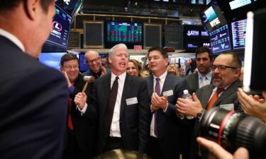 This 2018 photo shows Chris Wright ringing a ceremonial bell on the floor of the New York Stock Exchange shortly after the opening bell in New York.