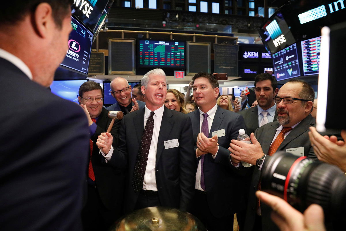 <i>Lucas Jackson/Reuters/File via CNN Newsource</i><br/>This 2018 photo shows Chris Wright ringing a ceremonial bell on the floor of the New York Stock Exchange shortly after the opening bell in New York.