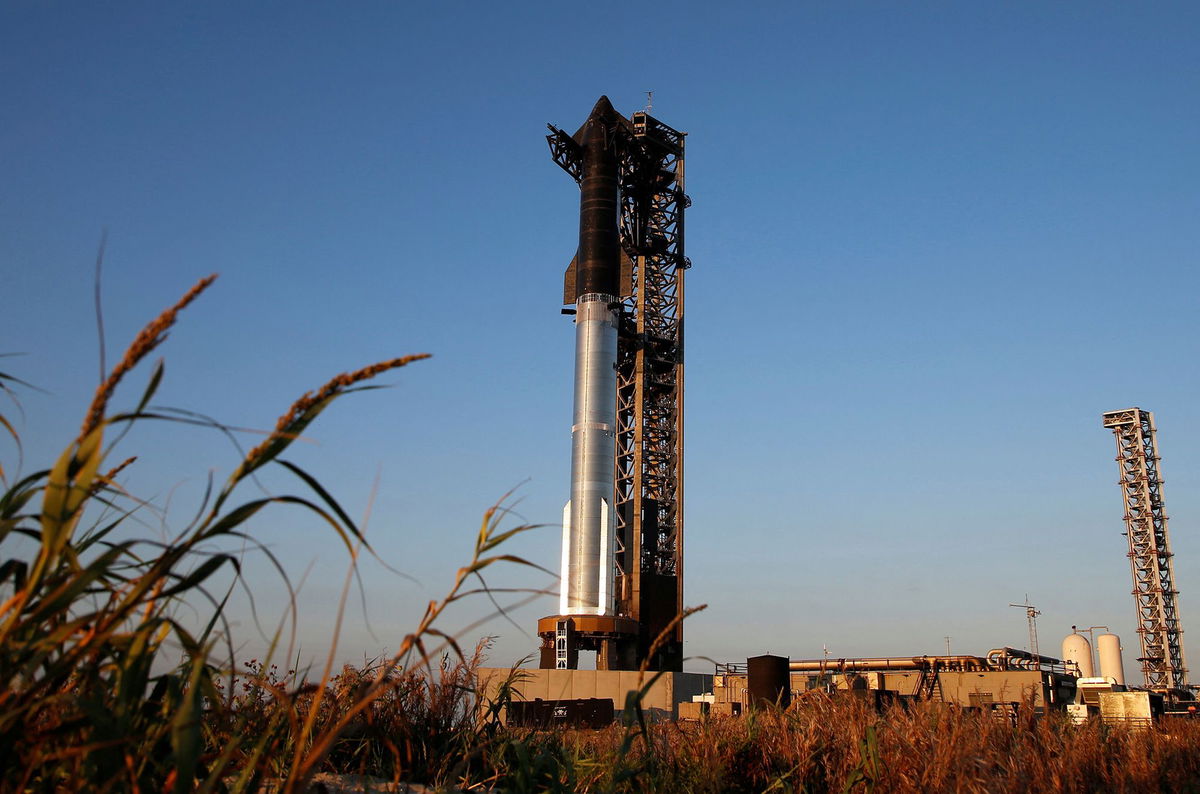 SpaceX's next-generation Starship spacecraft sits atop its powerful Super Heavy rocket booster on Saturday ahead of a sixth flight test at the company's launchpad near Brownsville, Texas.