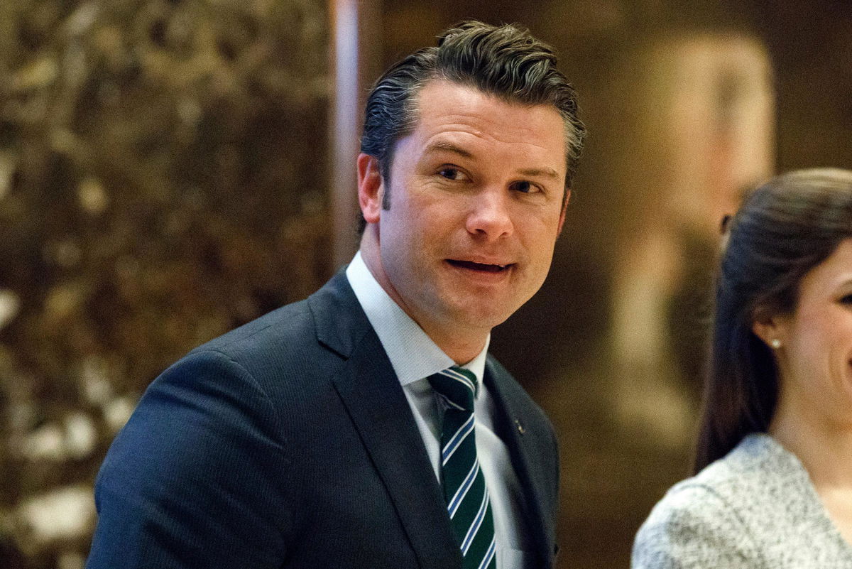 <i>Evan Vucci/AP via CNN Newsource</i><br/>Pete Hegseth walks to an elevator for a meeting with Trump at Trump Tower in New York in 2016.