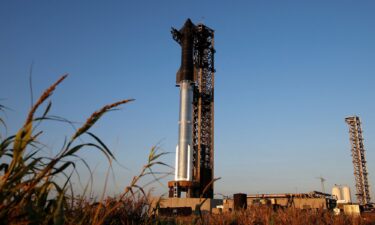 SpaceX's next-generation Starship spacecraft sits atop its powerful Super Heavy rocket booster on Saturday ahead of a sixth flight test at the company's launchpad near Brownsville