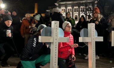 Hundreds from the Madison community gathered for a candlelight vigil at the state Capitol to grieve and begin processing Monday's deadly school shooting that left two victims dead and several injured.