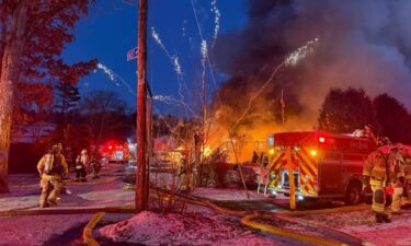 Crews encountered exploding fireworks and icy conditions at a fire that destroyed two homes in Spencer