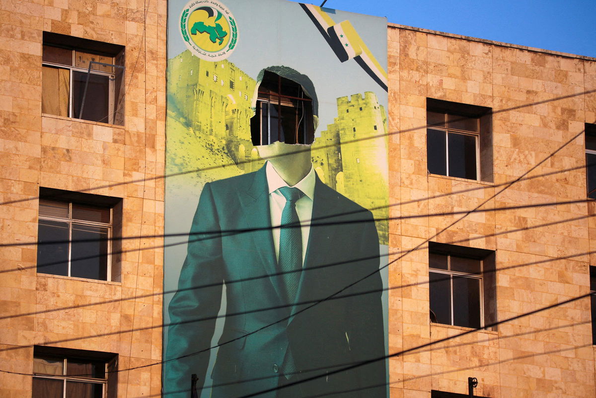 <i>Mahmoud Hassano/Reuters via CNN Newsource</i><br/>A view shows a damaged poster of Syria's President Bashar al-Assad in Aleppo after the Syrian army said that dozens of its soldiers had been killed in a major attack by rebels who swept into the city on November 30.