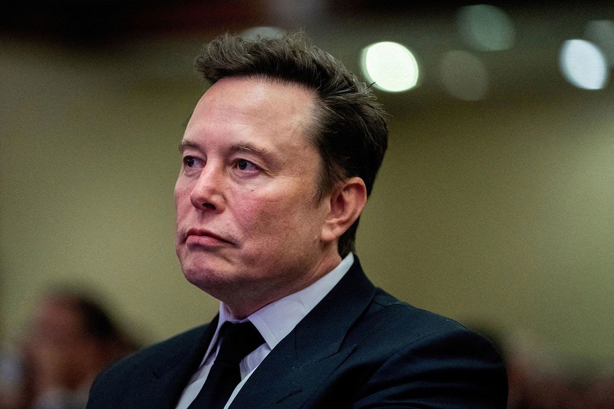 <i>Allison Robbert/Pool/Reuters/File via CNN Newsource</i><br/>Tesla CEO and X owner Elon Musk listens as US President-elect Donald Trump speaks during a meeting with House Republicans at the Hyatt Regency hotel in Washington