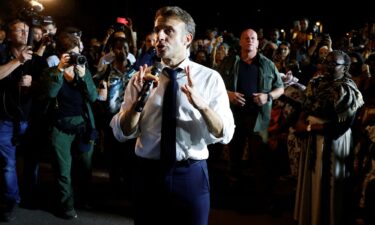 French President Emmanuel Macron speaks to the local residents during his visit in Pamandzi