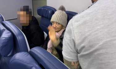 CNN’s Saskya Vandoorne captured a photo of the 57-year-old stowaway who is onboard a flight from Paris back to New York. CNN has now identified the Russian woman as Svetlana Dali.