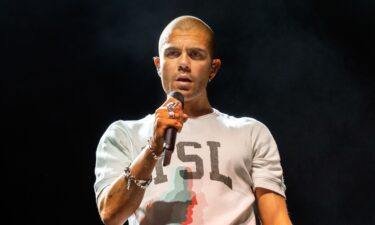 Max George of The Wanted is seen performing on stage in 2022 in Scotland. George is opening up about a health issue that he says will keep him in the hospital through the holidays.