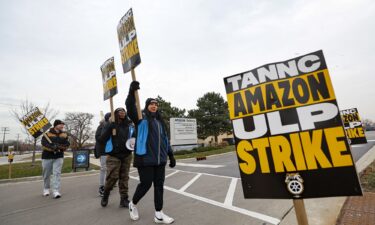 Striking workers picket outside an Amazon warehouse in City of Industry