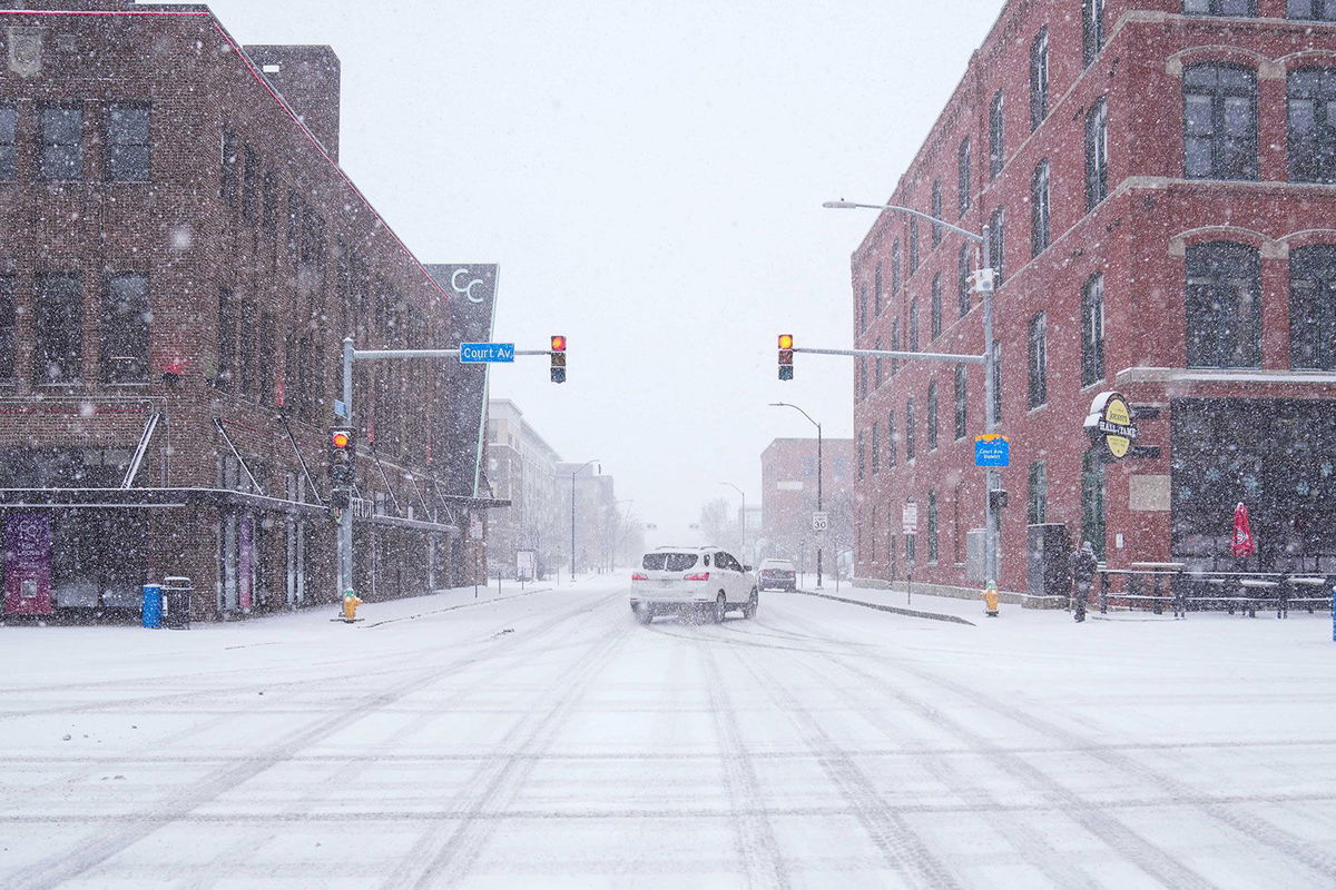 <i>Cody Scanlan/The Register/USA Today Network/Imagn Images via CNN Newsource</i><br/>A car slides around a corner amid snow in Des Moines