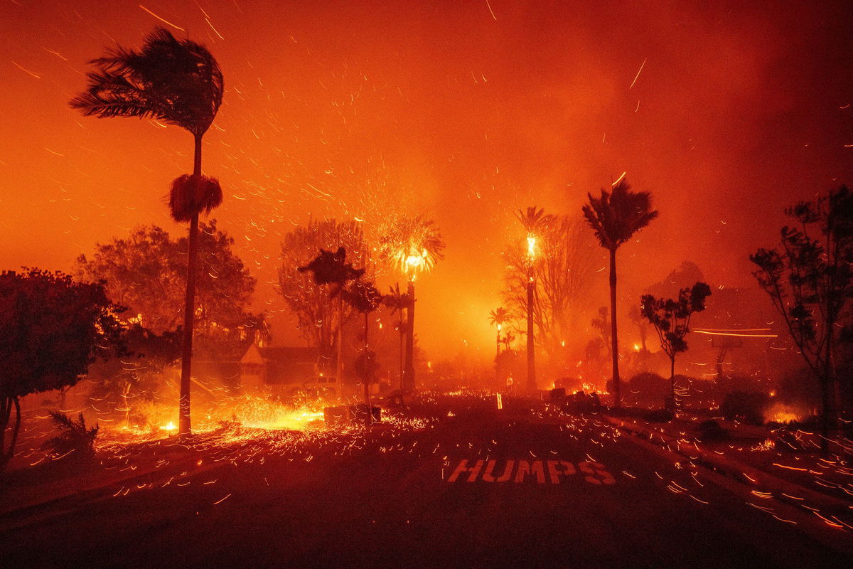 The Palisades Fire ravages a neighborhood amid high winds in the Pacific Palisades neighborhood of Los Angeles on January 7.