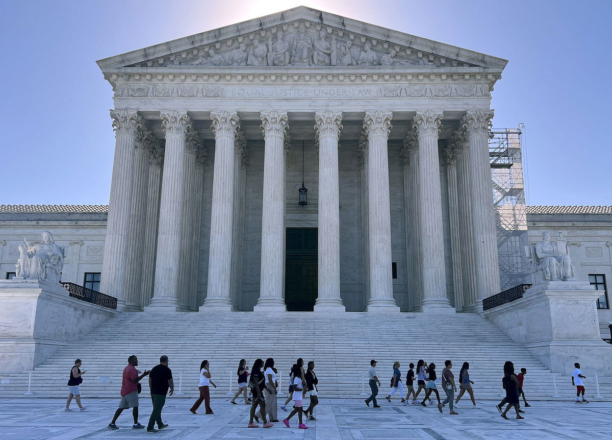 <i>Chip Somodevilla/Getty Images via CNN Newsource</i><br/>Tourists gather outside the U.S. Supreme Court on June 07