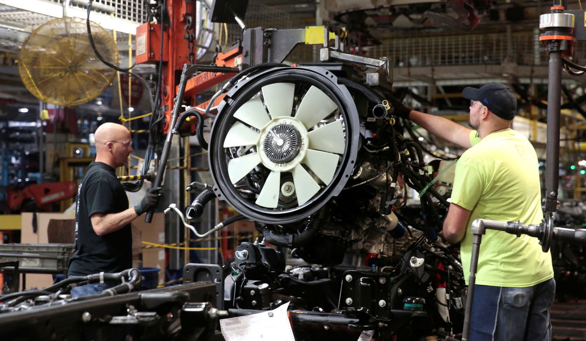 <i>Rebecca Cook/Reuters via CNN Newsource</i><br/>General Motors assembly workers attach the engine to the chassis of Chevrolet 2019 heavy-duty pickup trucks at General Motors Flint Assembly Plant in Flint