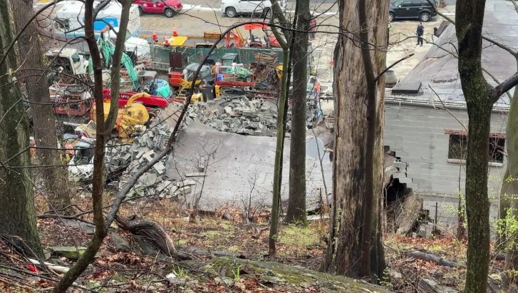 <i>Tony Aiello / WCBS/WLNY via CNN Newsource</i><br/>A large boulder caused a building to collapse Monday