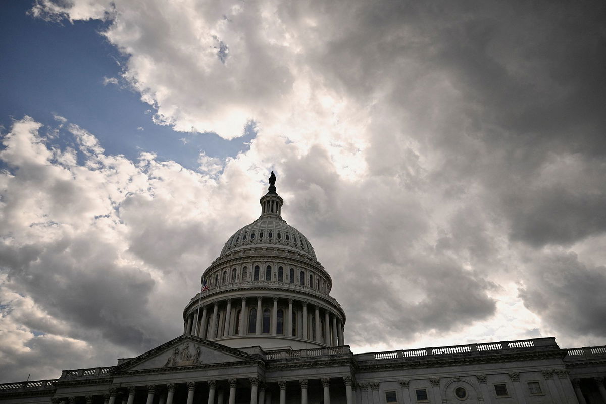 <i>Annabelle Gordon/Reuters via CNN Newsource</i><br/>Clouds roll over the US Capitol