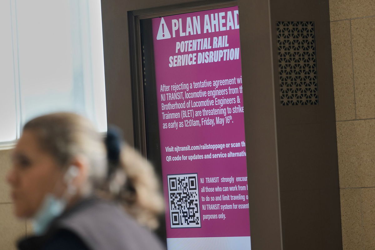 <i>Seth Wenig/AP via CNN Newsource</i><br/>An electronic display advises commuters of potential NJ Transit service disruptions at the Secaucus Junction station in Secaucus