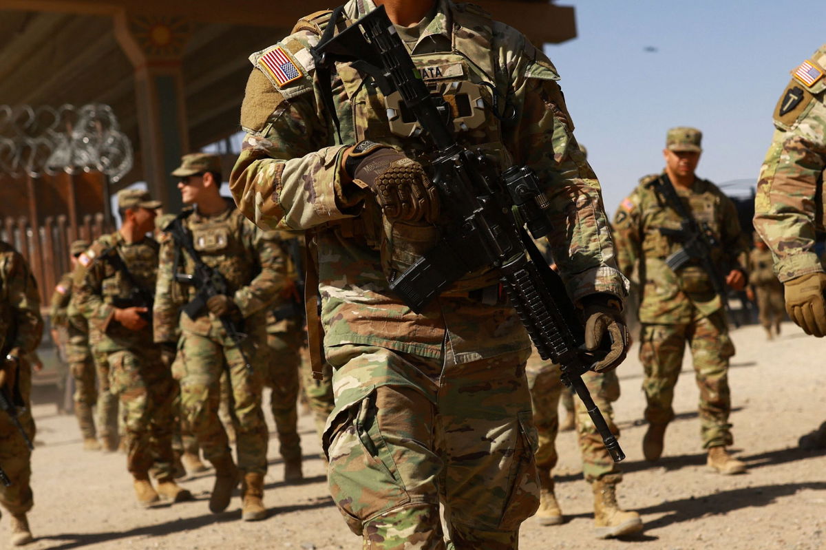 <i>Jose Luis Gonzalez/Reuters via CNN Newsource</i><br/>National Guard soldiers walk on the day U.S. authorities hold a ceremony to deputise the Texas National Guard to enforce Title 8 immigration laws