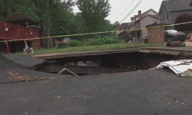 An 83-year-old self-described "go-getter" says he won't let the massive hole in his driveway that a storm left get him down. Instead