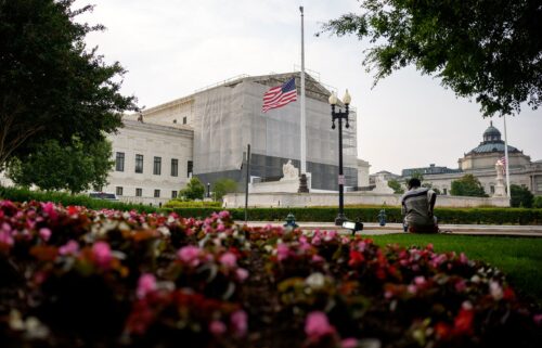 A person rests in front of the US Supreme Court on June 5 in Washington