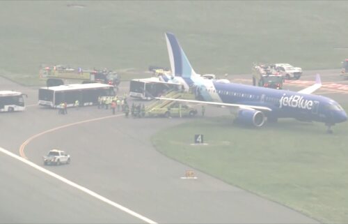 A jetBlue plane is seen off the runway at Boston Logan International Airport on June 12