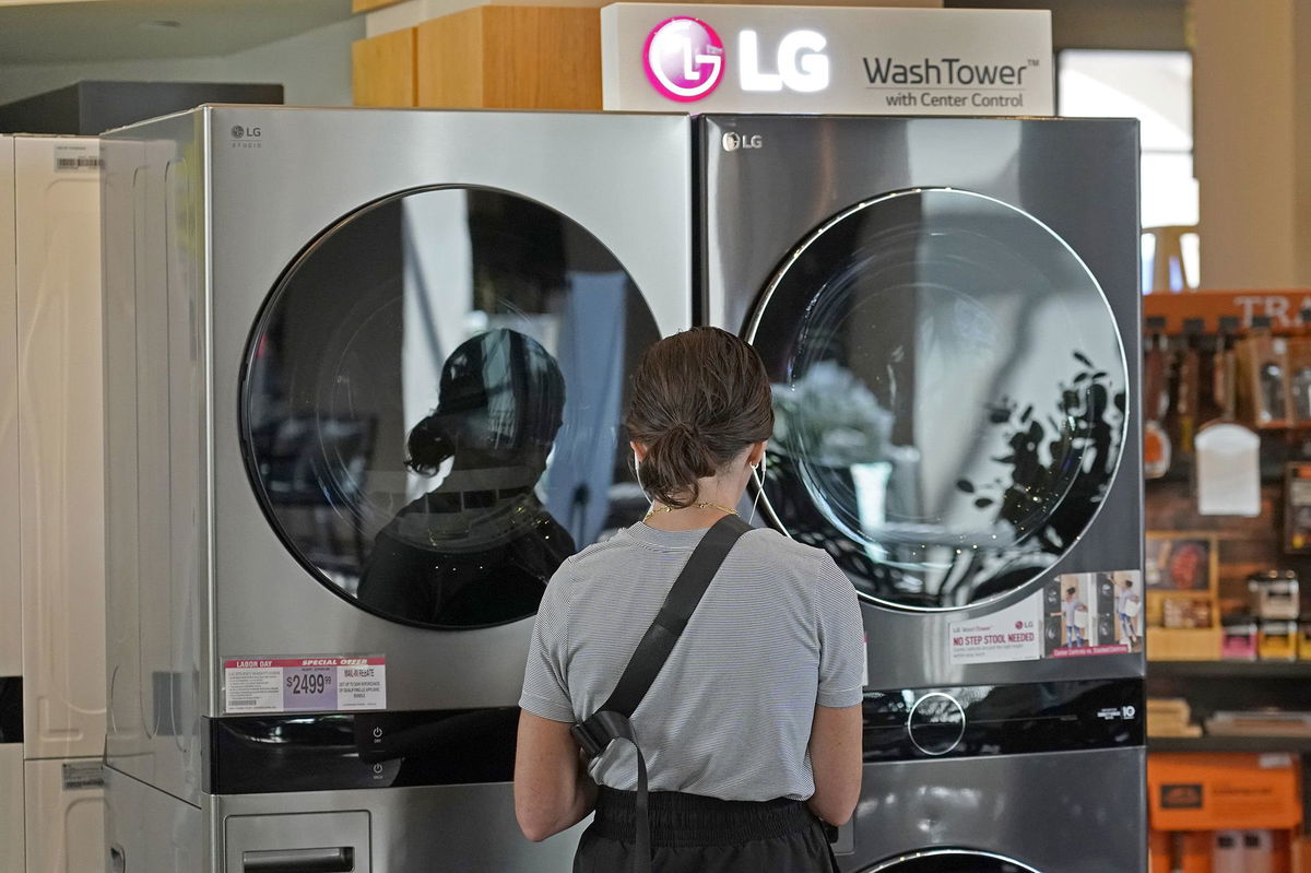 <i>George Frey/Bloomberg/Getty Images via CNN Newsource</i><br/>A customer looks at LG washing machines and dryers.