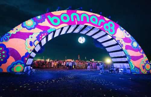 Disappointed fans seen at the Bonnaroo Arch after the Bonnaroo Music and Arts Festival 2025 is canceled on June 13